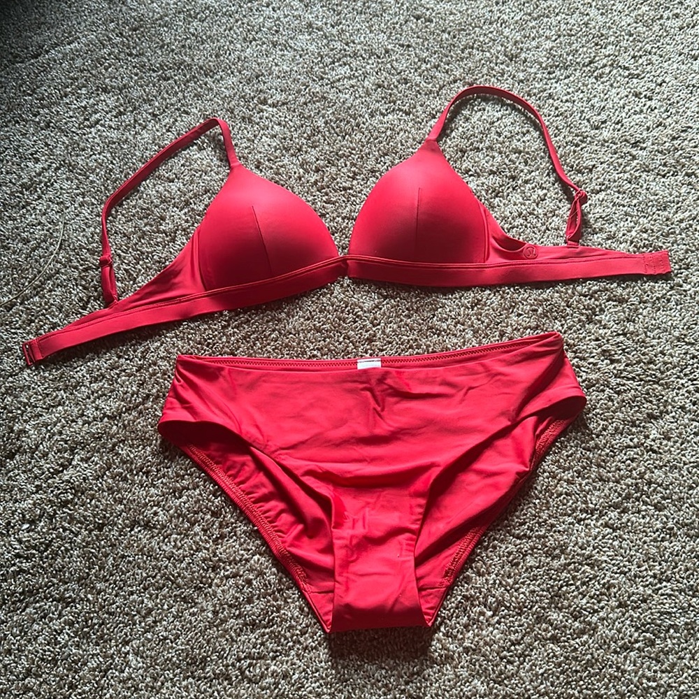 Never worn red bathing suit from Lululemon. Bottoms are a small & top is a 2.
